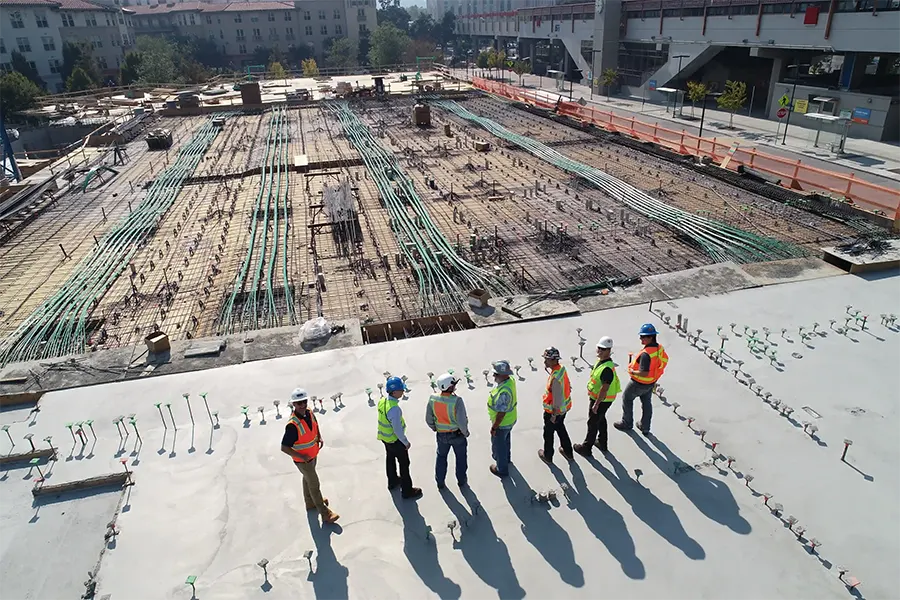 A group of constructors planning a build